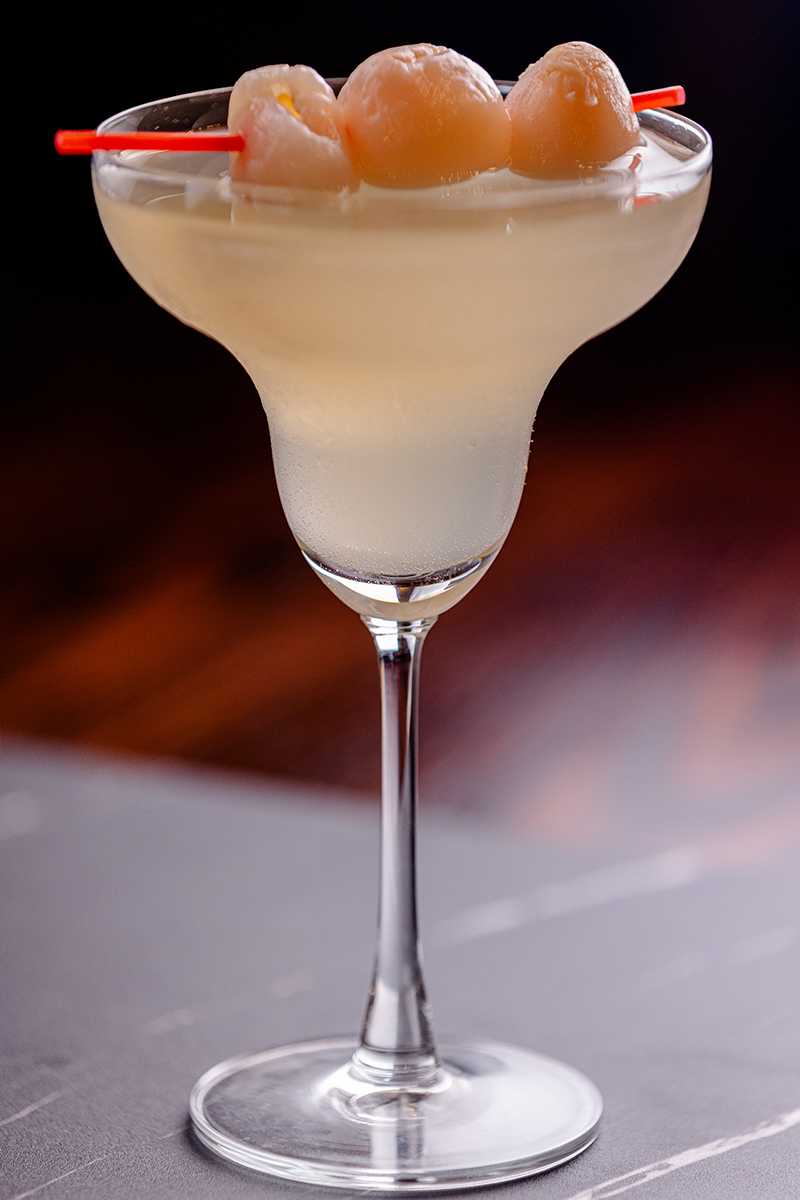 Cocktail garnished with lychees